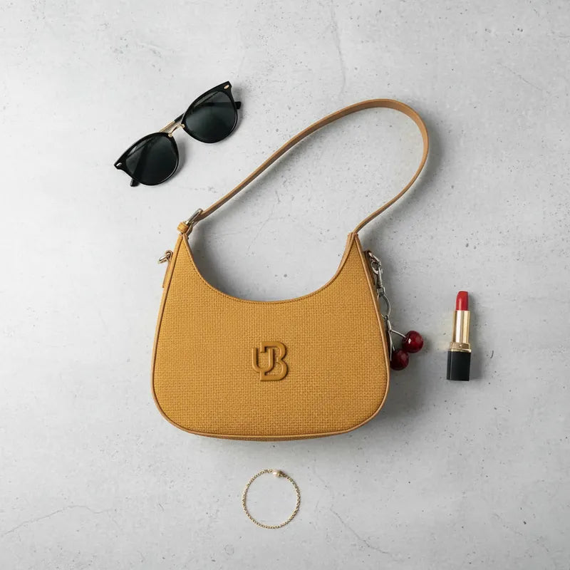 Cartera baguette con charm cereza Unibella
