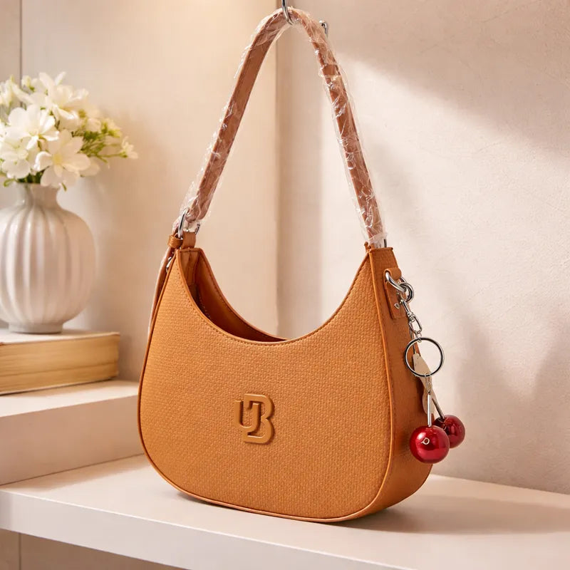 Cartera baguette con charm cereza Unibella
